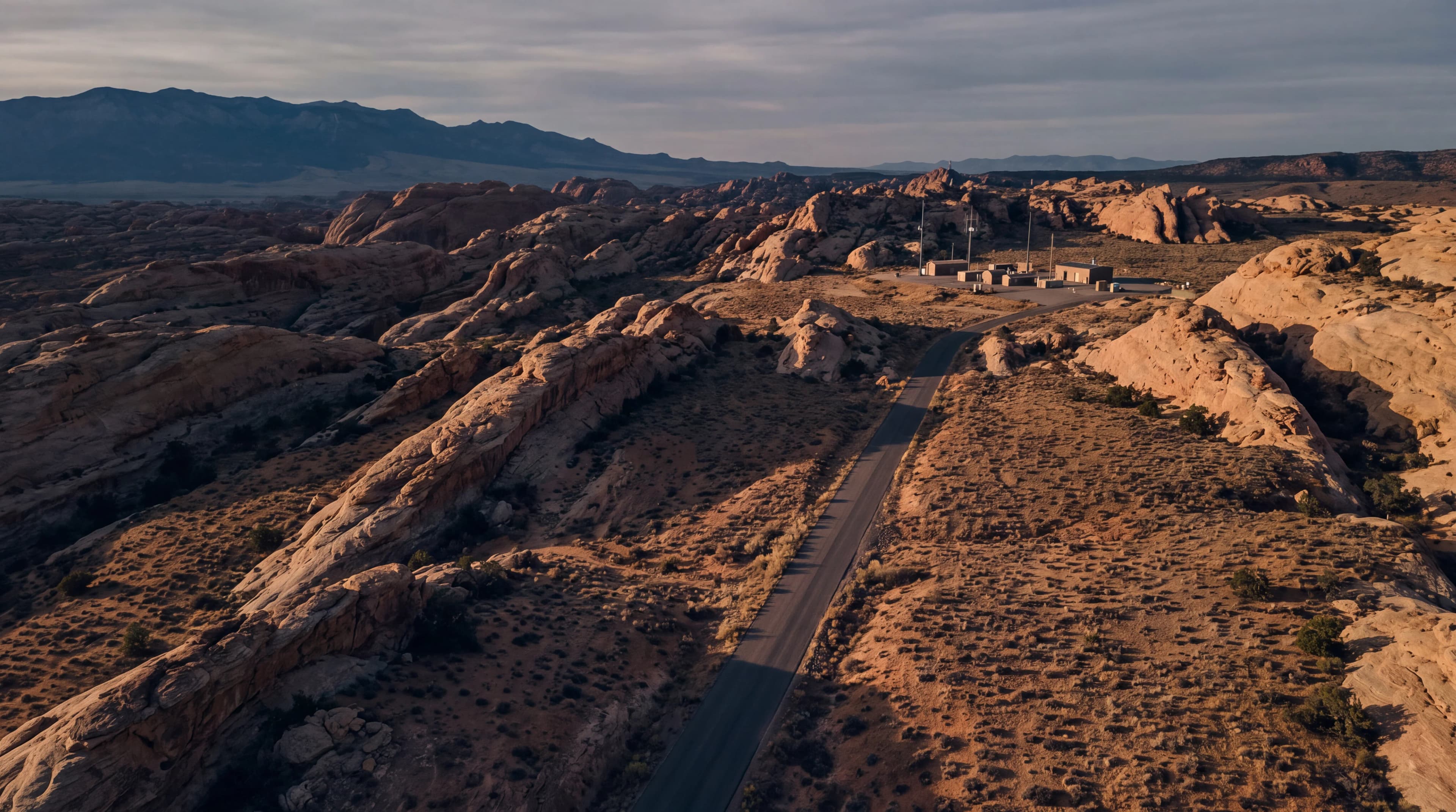 Generated aerial view of an access road across a remote desert